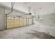 Spacious garage with high ceilings, multiple doors, and ample storage space at 5661 Rutland Trce, Lithonia, GA 30058