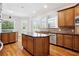 Gourmet kitchen with a central island, stainless steel appliances, and granite counters at 5661 Rutland Trce, Lithonia, GA 30058