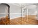 Bright and airy living room featuring hardwood floors and elegant architectural details at 5661 Rutland Trce, Lithonia, GA 30058