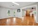 Living room with hardwood floors features natural light, TV, and an open concept design at 5661 Rutland Trce, Lithonia, GA 30058