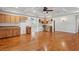 Spacious living room with hardwood floors, stylish cabinets, and coffered ceiling with modern fan at 5661 Rutland Trce, Lithonia, GA 30058