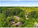 A lush, green view from above shows the property nestled among trees, with the city skyline in the distance at 1378 Sheffield Glen Ne Way, Atlanta, GA 30329