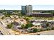 Aerial view of commercial area with multiple shops, businesses, parking and roads surrounded by cityscape at 1378 Sheffield Glen Ne Way, Atlanta, GA 30329
