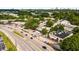 The aerial shot showcases shopping centers, roads, parking areas, and lush greenery against the city skyline at 1378 Sheffield Glen Ne Way, Atlanta, GA 30329