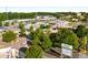 An aerial view displays the storefronts of local businesses, their parking lots, roads, and plenty of greenery at 1378 Sheffield Glen Ne Way, Atlanta, GA 30329