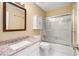 Bathroom featuring a white vanity with a stone countertop and sliding glass shower door at 1378 Sheffield Glen Ne Way, Atlanta, GA 30329