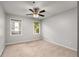 Cozy bedroom featuring neutral carpeting and a modern ceiling fan at 1378 Sheffield Glen Ne Way, Atlanta, GA 30329