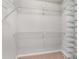 Walk in closet with multiple levels of metal shelving at 1378 Sheffield Glen Ne Way, Atlanta, GA 30329