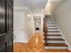 Welcoming entryway with hardwood floors, a staircase, and views into a light-filled living space at 1378 Sheffield Glen Ne Way, Atlanta, GA 30329