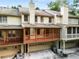 Townhome exterior featuring garages, covered patios, and siding at 1378 Sheffield Glen Ne Way, Atlanta, GA 30329