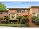 Charming brick townhouse with manicured landscaping and stairs leading to the front door at 1378 Sheffield Glen Ne Way, Atlanta, GA 30329