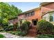 Charming red brick townhome with well-maintained landscaping and a welcoming entrance at 1378 Sheffield Glen Ne Way, Atlanta, GA 30329
