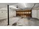 Garage with open door, shelving, and lighting at 1378 Sheffield Glen Ne Way, Atlanta, GA 30329