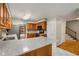 Features a kitchen with wood cabinets, granite countertops, stainless steel appliances and tile flooring at 1378 Sheffield Glen Ne Way, Atlanta, GA 30329