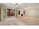 Large living room featuring a ceiling fan, a fireplace, and access to an outdoor deck at 1378 Sheffield Glen Ne Way, Atlanta, GA 30329