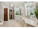 Large bathroom with white cabinets, double vanity, and large framed mirrors at 145 Ardsley Ln, Alpharetta, GA 30005