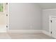 Neutral bedroom with carpeted floors and trim detail and door at 145 Ardsley Ln, Alpharetta, GA 30005
