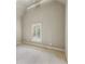 Bright bedroom with high ceilings and a window for natural light and carpeted floors at 145 Ardsley Ln, Alpharetta, GA 30005