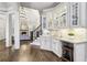 Functional butler's pantry offering ample storage, granite counters, and stylish design at 145 Ardsley Ln, Alpharetta, GA 30005
