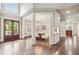 Spacious foyer with hardwood floors, dining room, and view to outside at 145 Ardsley Ln, Alpharetta, GA 30005