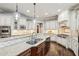 Lovely kitchen featuring granite counters, stainless steel appliances, and a center island with seating at 145 Ardsley Ln, Alpharetta, GA 30005