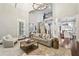 Spacious living room with high ceilings, hardwood floors, and an open floor plan at 145 Ardsley Ln, Alpharetta, GA 30005