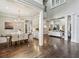 Open concept living space with hardwood floors, coffered ceiling, and lots of light at 145 Ardsley Ln, Alpharetta, GA 30005