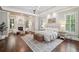 Spacious main bedroom boasts dark hardwood floors, a fireplace, and light gray walls at 145 Ardsley Ln, Alpharetta, GA 30005