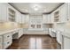 Home office with custom cabinetry, built-in desk, window seat, and hardwood floors at 145 Ardsley Ln, Alpharetta, GA 30005