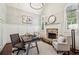Home office with stone fireplace, wainscoting, and lots of natural light at 145 Ardsley Ln, Alpharetta, GA 30005