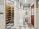 Spacious walk-in pantry with ample shelving, desk and a checkered floor tile design at 145 Ardsley Ln, Alpharetta, GA 30005