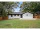Well-maintained backyard with lush lawn, modern fence, and charming exterior at 1934 Pinedale Pl, Decatur, GA 30032