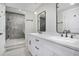 Modern bathroom featuring double vanities, sleek fixtures, and a glass-enclosed shower at 1934 Pinedale Pl, Decatur, GA 30032