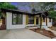 Charming renovated home with painted brick, new walkway, updated landscaping, wooden shutters and updated driveway at 1934 Pinedale Pl, Decatur, GA 30032