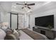 Main bedroom featuring a flat-screen TV and a bathroom with sliding barn door at 1934 Pinedale Pl, Decatur, GA 30032