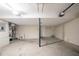 Unfinished basement with concrete floor and utility connections, providing ample potential for customization at 2183 Ramblewood Cir, Decatur, GA 30035
