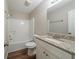 Bathroom with a tub/shower combo, and vanity with granite countertop at 2183 Ramblewood Cir, Decatur, GA 30035