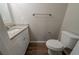 Bathroom with wood-look flooring, granite countertops, and a modern toilet at 2183 Ramblewood Cir, Decatur, GA 30035