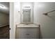 Stylish bathroom featuring a vanity with granite countertop and modern fixtures at 2183 Ramblewood Cir, Decatur, GA 30035