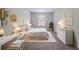 Calm bedroom featuring natural light, neutral decor, and a comfortable bed and dresser at 2183 Ramblewood Cir, Decatur, GA 30035