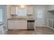 Kitchen featuring modern stainless-steel dishwasher and sink adjacent to the outdoor access at 2183 Ramblewood Cir, Decatur, GA 30035