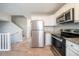 Well-lit kitchen with stainless steel appliances, open layout, and modern finishes at 2183 Ramblewood Cir, Decatur, GA 30035