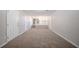 Spacious living room showing stairs to the kitchen, and neutral carpeting at 2183 Ramblewood Cir, Decatur, GA 30035