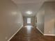 Open living room featuring wood-look flooring, neutral paint, and natural light at 2183 Ramblewood Cir, Decatur, GA 30035