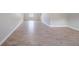 Spacious living room featuring wood-look flooring and ample natural light from a window at 2183 Ramblewood Cir, Decatur, GA 30035