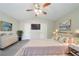 Cozy main bedroom with soft lighting, decorative artwork, and a large, inviting bed at 2183 Ramblewood Cir, Decatur, GA 30035