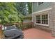 Wooden back deck with gas grill and view of lush landscaping at 3120 Beechwood Se Dr, Marietta, GA 30067