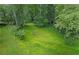 Sloping, grassy backyard with mature trees provides peaceful privacy at 3120 Beechwood Se Dr, Marietta, GA 30067
