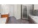 Bathroom features a shower, jacuzzi tub and dark tile surround at 3120 Beechwood Se Dr, Marietta, GA 30067