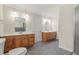 Bathroom with and sinks, wood cabinets and tile flooring at 3120 Beechwood Se Dr, Marietta, GA 30067